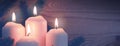 Four burning Advent candles and white snow. Royalty Free Stock Photo