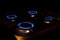 Four burning burners at night. Bright fire. The concept of expensive gas and energy resources. Increasingly expensive natural gas Royalty Free Stock Photo