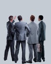 Four business mans from the back - looking at something over a white background. Royalty Free Stock Photo