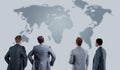 Four business mans from the back - looking at the world. Royalty Free Stock Photo