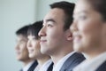 Four Business people sitting in a row, portrait Royalty Free Stock Photo