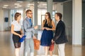 Four business people talking in office lobby Royalty Free Stock Photo