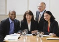 Four business workers smiling Royalty Free Stock Photo