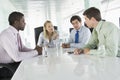 Four Businesspeople Having Meeting