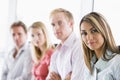 Four businesspeople sitting indoors