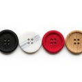 Four buttons in various materials isolated on white background Royalty Free Stock Photo