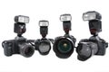 Four Cameras with flashes on white background