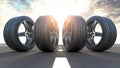 Four car wheels on the road. Auto service, workshop or changing car tyres concept.