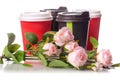 Four cardboard coffee cups flowers Royalty Free Stock Photo