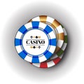 Four colorful casino Chips on the white-grey background.