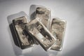 Four cast silver bars on a gray background. Royalty Free Stock Photo