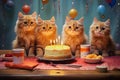 Four cats celebrating a birthday with cake.