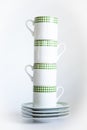 Four ceramic cup overlapping on white backdrop Royalty Free Stock Photo