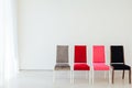 Four chairs in the interior of an empty white room Royalty Free Stock Photo