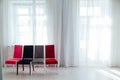 Four chairs in the interior of an empty white room Royalty Free Stock Photo