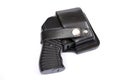 Four-charging traumatic gun in a leather holster on a white background. Royalty Free Stock Photo