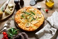 Four cheese pizza with pear and arugula on rustic wood Royalty Free Stock Photo