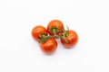 Four cherry tomatoes isolated on a white background Royalty Free Stock Photo