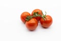 Four cherry tomatoes isolated on a white background Royalty Free Stock Photo