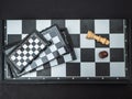 Four chessboards of different sizes lying on top of each other