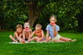 Four children are eating watermelon. Child eat fruit outdoors. A healthy snack for kids Royalty Free Stock Photo