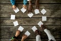 Four children of mixed races assembling a heart shape of white c