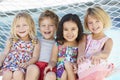Four Children Relaxing In Garden Hammock Together Royalty Free Stock Photo