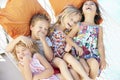 Four Children Relaxing In Garden Hammock Together Royalty Free Stock Photo