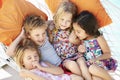 Four Children Relaxing In Garden Hammock Together Royalty Free Stock Photo