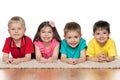 Four children on the white carpet Royalty Free Stock Photo