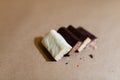 Four chocolate protein bars with different flavors in the context of sprinkle rice flakes on baking paper, Teflon paper. Whey prot Royalty Free Stock Photo