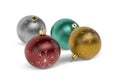 Four Christmas balls in silver, gold, green and red colors isolated on white background Royalty Free Stock Photo