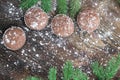 Four Christmas cakes, winter snowbound wooden background, fir br