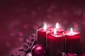 Four burning red candles for Advent. Christmas background. Royalty Free Stock Photo