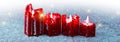 Four red candles for Advent. Christmas background. Royalty Free Stock Photo