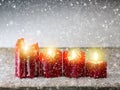 Four red Christmas candle for Advent. Christmas background. Royalty Free Stock Photo