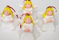 Four Christmas cherubs an angel stand on a white background, decorative decoration on the Christmas tree, Royalty Free Stock Photo