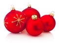 Four Christmas decoration red baubles isolated on white background