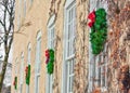 Four Christmas Wreaths Hanging on Building
