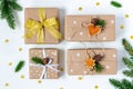 Four Christmas and New Year presents wrapped in eco paper