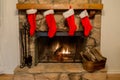 Four Christmas Stockings Hung By The Fireplace With Care.