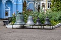 Four church bells stand on a pedestal in the courtyard of Pokrovsky Monastery in Kharkov.