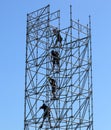 Four climbers riggers on a high metal structure Royalty Free Stock Photo