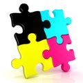 Four CMYK jigsaw puzzle pieces