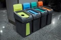 Four color coded recycle garbage bins. Royalty Free Stock Photo