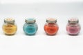 Four Color Sorted Candles in Glass