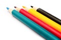 Four colored pencils. The colors cyan, magenta, yellow and black. The concept of polygraphy Royalty Free Stock Photo