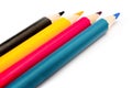 Four colored pencils. The colors cyan, magenta, yellow and black. The concept of polygraphy