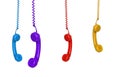 Four colored phones hanging Royalty Free Stock Photo