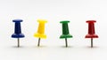 Four colored push pins in a row Royalty Free Stock Photo